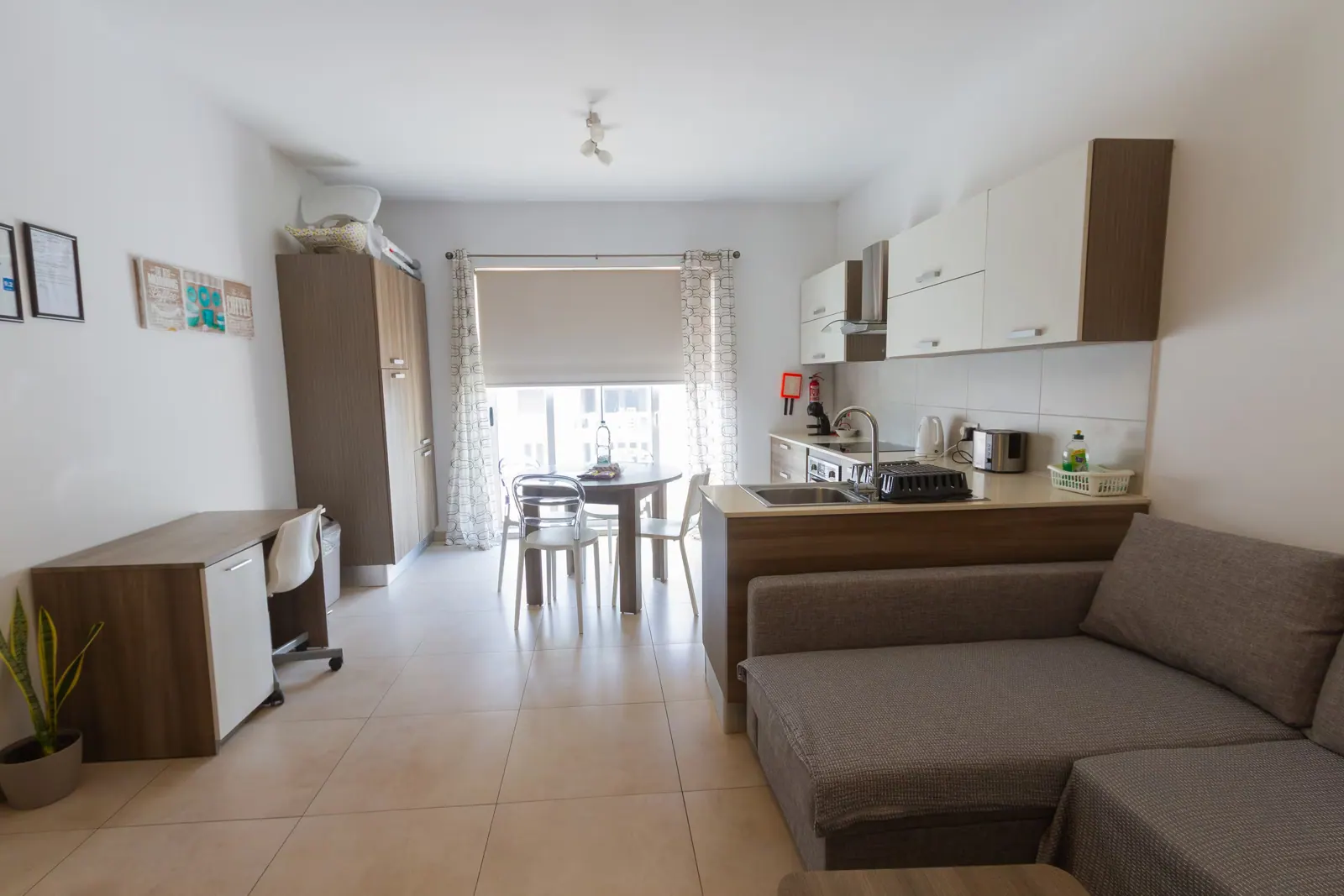 Living and dining area with balcony doors